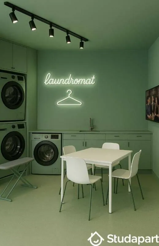 Buanderie commune avec lave-linge et sèche-linge